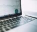 A laptop showing an analytics dashboard with charts and graphs, symbolizing modern data analysis tools.