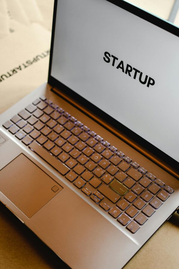 Sleek laptop displaying the word 'STARTUP', ideal for tech and business themes.