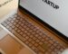Sleek laptop displaying the word 'STARTUP', ideal for tech and business themes.